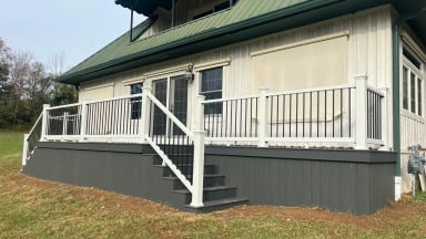 Modern house exterior with deck and green roof